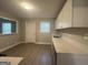 Modern kitchen with white cabinets, quartz countertops, and stainless steel appliances at 2658 Rollingwood Se Ln, Atlanta, GA 30316
