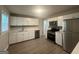 Updated kitchen, featuring white shaker cabinets and stainless steel appliances at 2658 Rollingwood Se Ln, Atlanta, GA 30316