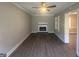 Living room with fireplace, hardwood floors, and built-in shelving at 2658 Rollingwood Se Ln, Atlanta, GA 30316