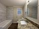 Updated bathroom with granite vanity and tile shower at 4906 Springbrook Dr, Douglasville, GA 30135