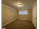 Spacious bedroom with neutral wall paint and carpet flooring at 4906 Springbrook Dr, Douglasville, GA 30135