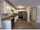 Galley style kitchen with granite counters and stainless appliances at 4906 Springbrook Dr, Douglasville, GA 30135