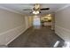 Bright living room with new carpet and view into kitchen at 4906 Springbrook Dr, Douglasville, GA 30135