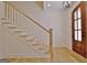 Elegant entryway with hardwood floors and a stunning staircase at 2178 Bear Creek Rd, Moreland, GA 30259