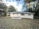 House exterior showcasing a backyard with patio and landscaping at 1737 Mckenzie Dr, Decatur, GA 30032