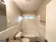 Neat bathroom with a bathtub, granite countertop, and tiled walls at 1737 Mckenzie Dr, Decatur, GA 30032