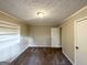 Cozy bedroom with neutral carpeting and built-in shelving at 1737 Mckenzie Dr, Decatur, GA 30032