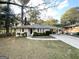Charming ranch home featuring a carport and spacious front yard at 1737 Mckenzie Dr, Decatur, GA 30032
