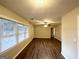 Hardwood floor living room with large windows and neutral decor at 1737 Mckenzie Dr, Decatur, GA 30032