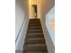 Carpeted staircase leading to the second floor at 3033 Winding Grove Dr, Lithonia, GA 30038