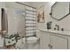 Updated bathroom with granite vanity, white cabinets, and a stylish shower curtain at 12021 Scottish Ct, Fayetteville, GA 30215