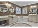 Primary bathroom with double vanities, a corner tub, and separate shower at 12021 Scottish Ct, Fayetteville, GA 30215
