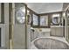 Large bathroom with double vanities, a garden tub, and a separate shower at 12021 Scottish Ct, Fayetteville, GA 30215