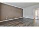 Spacious bedroom with dark hardwood floors and neutral walls at 12021 Scottish Ct, Fayetteville, GA 30215