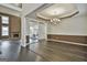 Elegant dining room with hardwood floors, chandelier, and access to the kitchen at 12021 Scottish Ct, Fayetteville, GA 30215