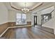 Bright dining room with hardwood floors, chandelier and views to the entry and kitchen at 12021 Scottish Ct, Fayetteville, GA 30215