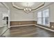 Formal dining room featuring hardwood floors, a chandelier and window seating at 12021 Scottish Ct, Fayetteville, GA 30215