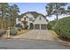 Two-story house with white exterior, landscaping, and a two-car garage at 12021 Scottish Ct, Fayetteville, GA 30215