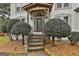 Elegant front entry with stone steps and a covered porch at 12021 Scottish Ct, Fayetteville, GA 30215