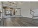 Open floor plan Gathering room with hardwood floors, and a view of the kitchen and stairs at 12021 Scottish Ct, Fayetteville, GA 30215