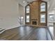 High-ceiling Gathering room with stone fireplace and hardwood floors at 12021 Scottish Ct, Fayetteville, GA 30215