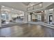 Two story Gathering room with hardwood floors, high ceilings, and views of the kitchen and dining areas at 12021 Scottish Ct, Fayetteville, GA 30215