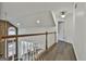 Bright hallway with dark hardwood floors and access to bedrooms at 12021 Scottish Ct, Fayetteville, GA 30215