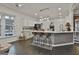 Modern kitchen featuring an island and white cabinetry at 12021 Scottish Ct, Fayetteville, GA 30215