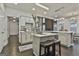 Open kitchen with large island, high ceilings, and stone fireplace at 12021 Scottish Ct, Fayetteville, GA 30215