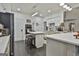 Updated kitchen with white cabinets, quartz countertops, and an island at 12021 Scottish Ct, Fayetteville, GA 30215