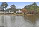 Stunning lakefront home with a large deck and beautiful landscaping at 12021 Scottish Ct, Fayetteville, GA 30215