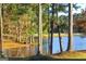 Serene view of a lake, picnic table, and ducks at 12021 Scottish Ct, Fayetteville, GA 30215