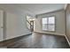 Spacious living area with hardwood floors and a view of the front entrance at 12021 Scottish Ct, Fayetteville, GA 30215
