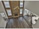 Spacious living room with a stone fireplace and hardwood floors at 12021 Scottish Ct, Fayetteville, GA 30215