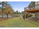 Large patio area with a view of the lake and surrounding landscape at 12021 Scottish Ct, Fayetteville, GA 30215