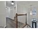 Elegant staircase with wooden railing overlooking the foyer and living areas at 12021 Scottish Ct, Fayetteville, GA 30215