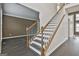 Open staircase with dark hardwood floors and white risers at 12021 Scottish Ct, Fayetteville, GA 30215