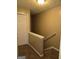 Upper hallway with carpeted floor and a door at 3044 Waldrop Cir, Decatur, GA 30034