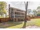 House exterior showcasing a screened porch, wooden stairs, and fenced yard at 3946 Pinehurst Pl, Decatur, GA 30034