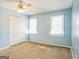 Well-lit bedroom with light blue walls, double-door closet and ceiling fan at 3946 Pinehurst Pl, Decatur, GA 30034