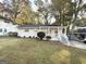 Charming brick ranch home with a red front door and well-manicured lawn at 2228 Sw Springdale Cir, Atlanta, GA 30315