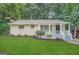 Newly renovated ranch home with covered porch and landscaped lawn at 2228 Sw Springdale Cir, Atlanta, GA 30315