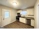 Modern kitchen with white cabinets, granite countertops, and stainless steel appliances at 2228 Sw Springdale Cir, Atlanta, GA 30315