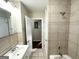 Bathroom with a vanity, shower, and tub at 8406 Norris Lake Rd, Snellville, GA 30039