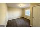 Simple bedroom with neutral walls and carpeting at 8406 Norris Lake Rd, Snellville, GA 30039