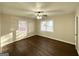 Spacious bedroom with hardwood floors and ceiling fan at 8406 Norris Lake Rd, Snellville, GA 30039