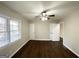 Well-lit bedroom featuring hardwood floors and ample closet space at 8406 Norris Lake Rd, Snellville, GA 30039