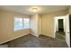 Bright bedroom with neutral walls, carpet, and ample natural light at 8406 Norris Lake Rd, Snellville, GA 30039
