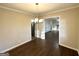 Bright dining room with hardwood floors and view into the living room at 8406 Norris Lake Rd, Snellville, GA 30039