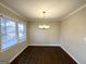 Dining room with hardwood floors and a chandelier at 8406 Norris Lake Rd, Snellville, GA 30039
